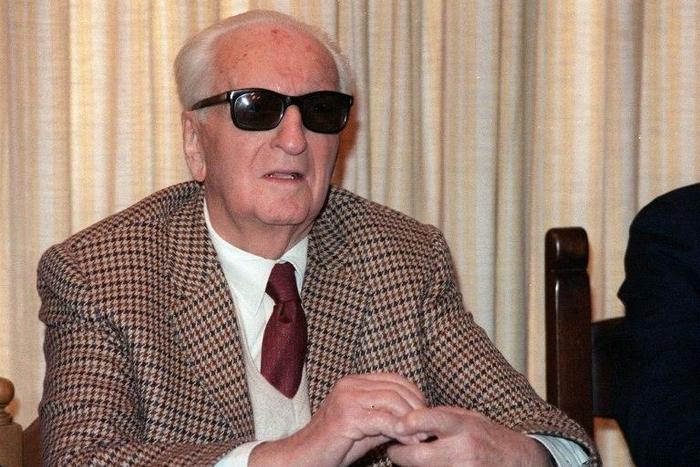 Formula One legend Enzo Ferrari, pictured in March 1987, is buried in a cemetery in Modena behind a plate of marble in a large chapel secured by a heavy iron gate