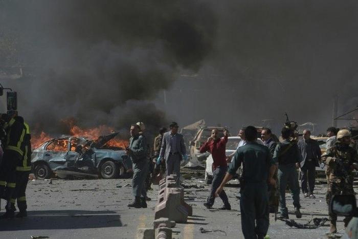 Afghan security forces personnel at the site of a car bomb attack in Kabul on May 31, 2017