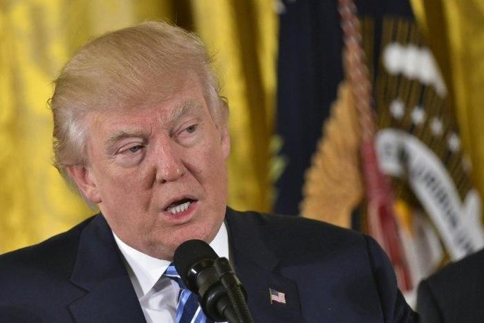 US President Donald Trump speaks during the swearing-in of the White House senior staff on January 22, 2017, in Washington, DC