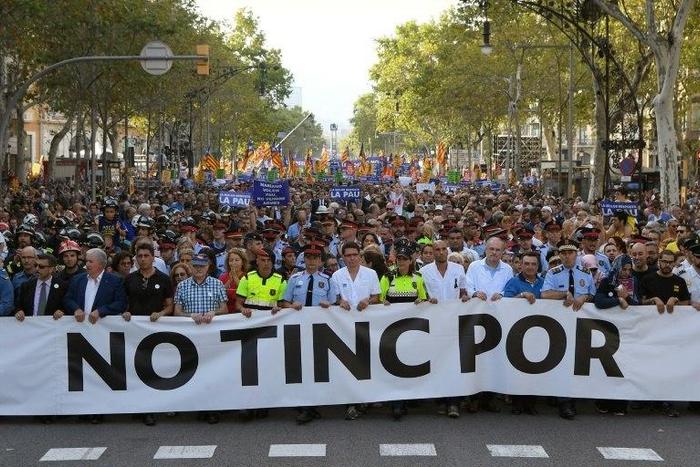 Tens of thousands marched in Barcelona on Saturday to commemorate the two deadly attacks in Catalonia, including Spain's King Felipe VI