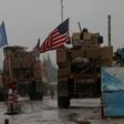 A line of US military vehicles head to their base on the outskirts of the northern Syrian city of Manbij on December 30, 2018