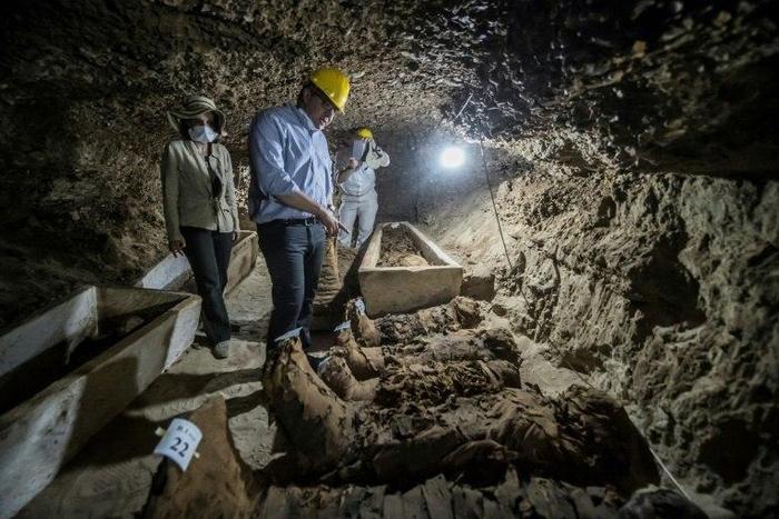 Egyptian Antiquities Minister Khaled el-Enany (C) speaks to media on May 13, 2017, in front of mummies discovered in catacombs in Touna el-Gabal district, Minya province, in central Egypt