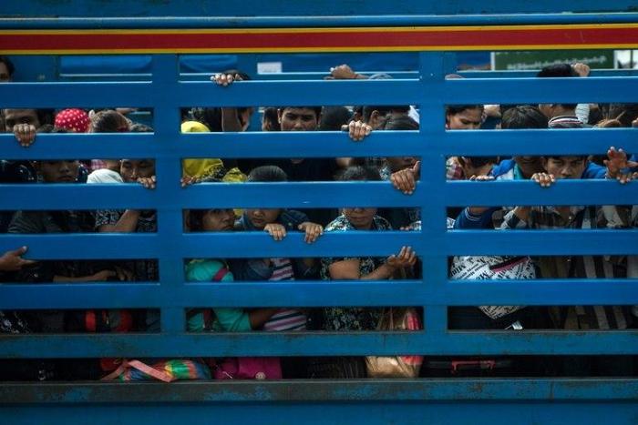 Tens of thousands of Myanmar migrants have fled Thailand in fear of a new law that hardens penalties on the millions of undocumented migrant workers underpinning its economy