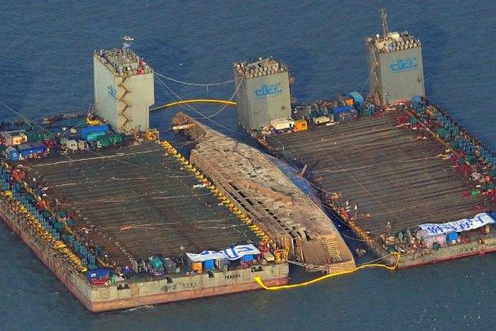 The damaged Sewol ferry was held afloat between two barges during a salvage operation off the South Korean island of Jindo, on March 23, 2017
