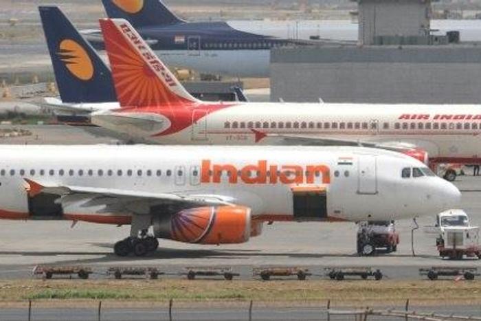 A politician has admitted hitting an air steward on an Air India flight with a slipper 25 times
