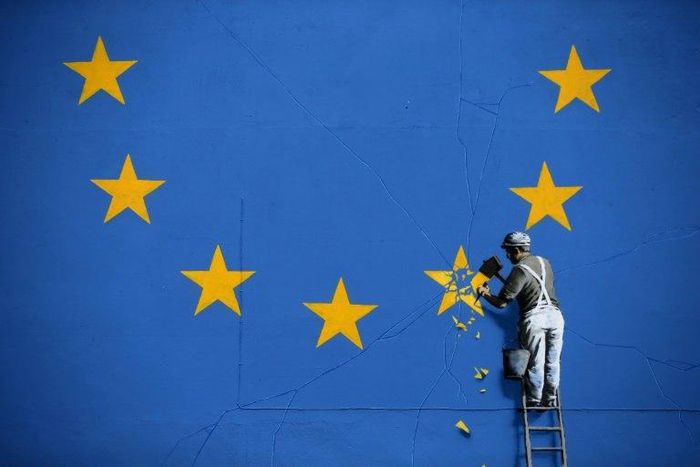 A recently painted mural by British graffiti artist Banksy, depicting a workman chipping away at one of the stars on a European Union flag