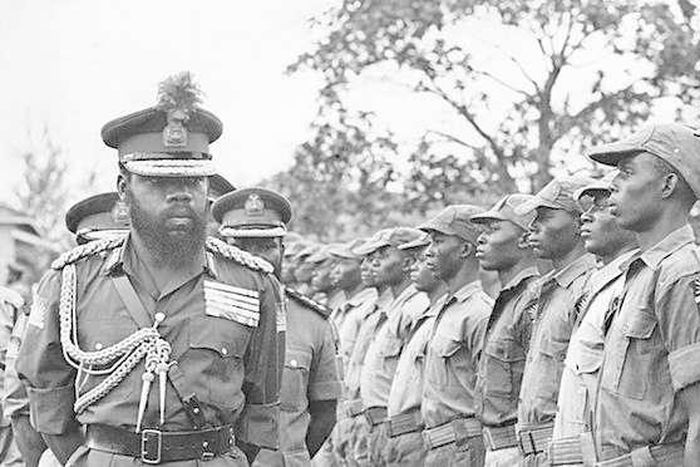 Chukwuemeka Odumegwu Ojukwu, Biafra Head of State inspecting a parade