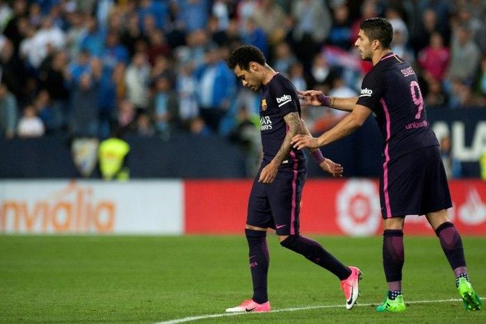Barcelona's Brazilian forward Neymar da Silva (L) walks off the pitch during the Spanish league football match Malaga CF vs FC Barcelona at La Rosaleda stadium in Malaga on April 8, 2017