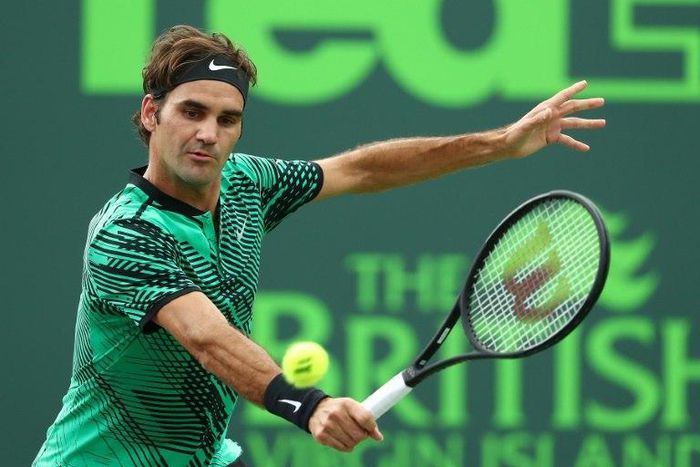 Roger Federer of Switzerland returns a shot against Frances Tiafoe during day 6 of the Miami Open at Crandon Park Tennis Center on March 25, 2017 in Key Biscayne, Florida