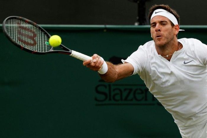 Argentina's Juan Martin del Potro returns against Australia's Thanasi Kokkinakis during their men's singles first round match on the second day of the 2017 Wimbledon Championships July 4, 2017