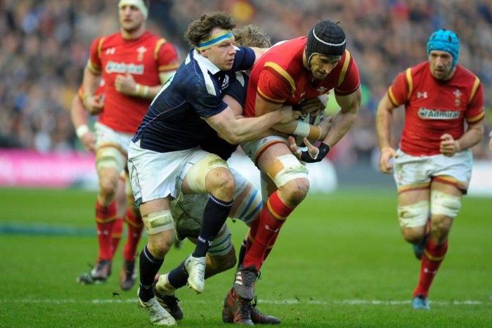 Scotland's Hamish Watson (left) tackles Wales' lock Luke Charteris during the Six Nations rugby union match at Murrayfield in Edinburgh on Febuary 25, 2017