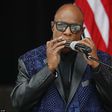Stevie Wonder playing his harmonica before Obama's speech