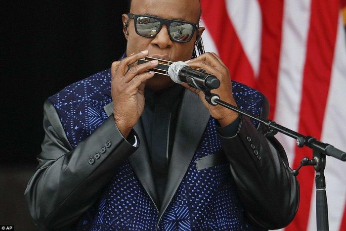 Stevie Wonder playing his harmonica before Obama's speech