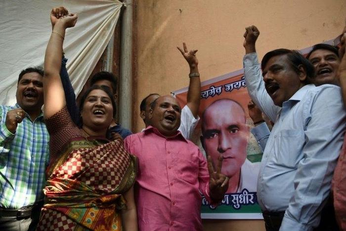 Friends of Indian national Kulbhushan Jadhav celebrate in Mumbai on May 18, 2017 after he is given a stay of execution in a high-profile case at the International Court of Justice