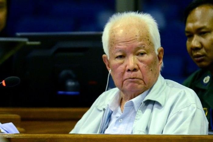 Former Khmer Rouge leader head of state Khieu Samphan (C) denies being part of the killing machine that decimated nearly a quarter of Cambodia's population