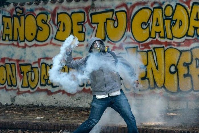 Crowds of students clashed with riot police in Caracas