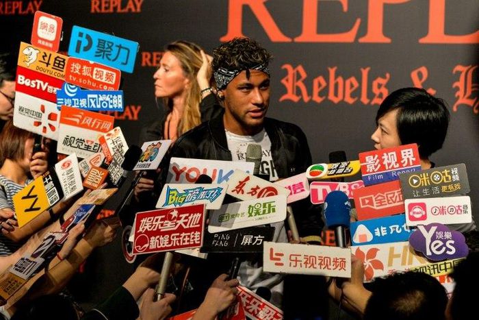 Brazilian footballer Neymar speaks to media at a fashion event in Shanghai on July 31, 2017