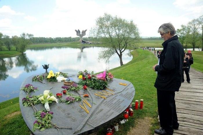 A man looks at the World War II Jasenovac memorial camp model on April 26, 2015, during a ceremony to remember the tens of thousands who were killed by the country's pro-Nazi regime