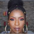 Fulani Inspired braids with vibrant glowing makeup look