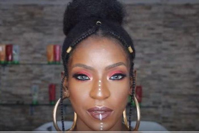 Fulani Inspired braids with vibrant glowing makeup look
