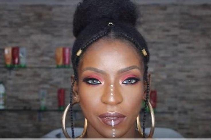 Fulani Inspired braids with vibrant glowing makeup look