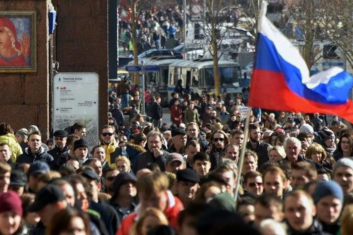 Protesters walk along Moscow's Tverskaya street during an unauthorised anti-corruption rally on March 26, 2017