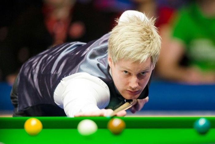 Australia's Neil Robertson plays a shot against England's Mark Selby during the Masters Snooker final at Alexandra Palace in north London on January 20, 2013