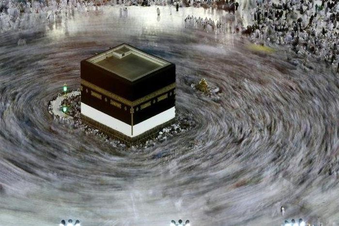 This long exposure photograph shows Muslim pilgrims circumambulating the Kaaba, Islam's holiest shrine, at the Grand Mosque in Saudi Arabia's holy city of Mecca on August 27, 2017, prior to the start of the annual Hajj pilgrimage