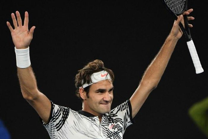 Switzerland's Roger Federer celebrates his victory against his compatriot Stanislas Wawrinka during their Australian Open semi-final match in Melbourne, on January 26, 2017