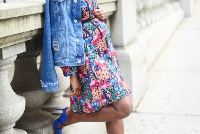 Nifesimi throws on a distressed denim over floral skater dress