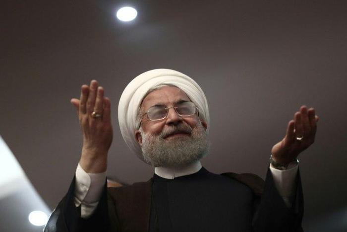 Iranian President Hassan Rouhani gestures during a campaign rally in the northwestern city of Ardabil on May 17, 2017