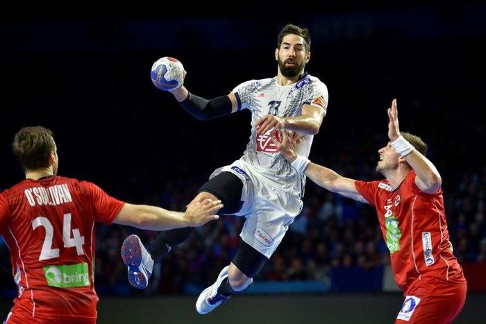 France's centre back Nikola Karabatic vies with Norway's pivot Bjarte Myrhol (R) during the 25th IHF Men's World Championship 2017 Group A handball match France vs Norway on January 15, 2017 at the Parc des Expositions in Nantes