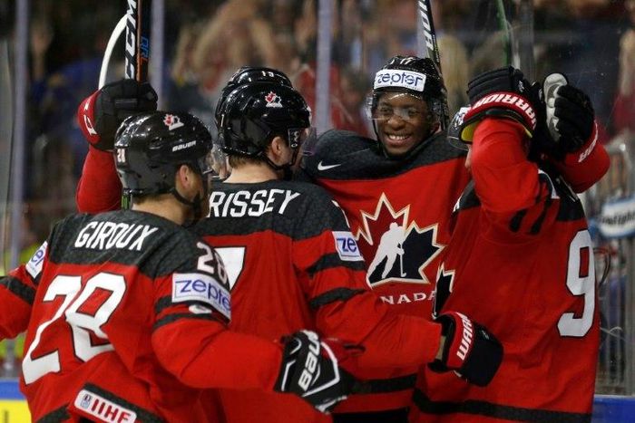Canada's players celebrate a goal during the IIHF Men's World Championship Ice Hockey semi-final match against Russia in Cologne on May 20, 2017