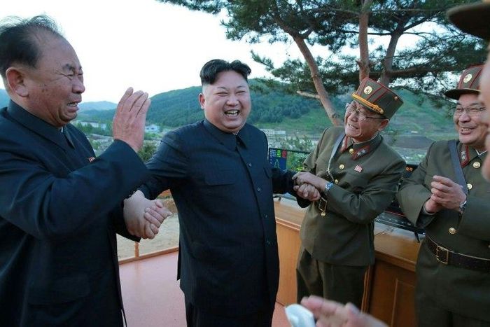 North Korean leader Kim Jong-Un, shown reacting during an earlier missile launch, has overseen a test of a new anti-aircraft guided weapon system, according to state media