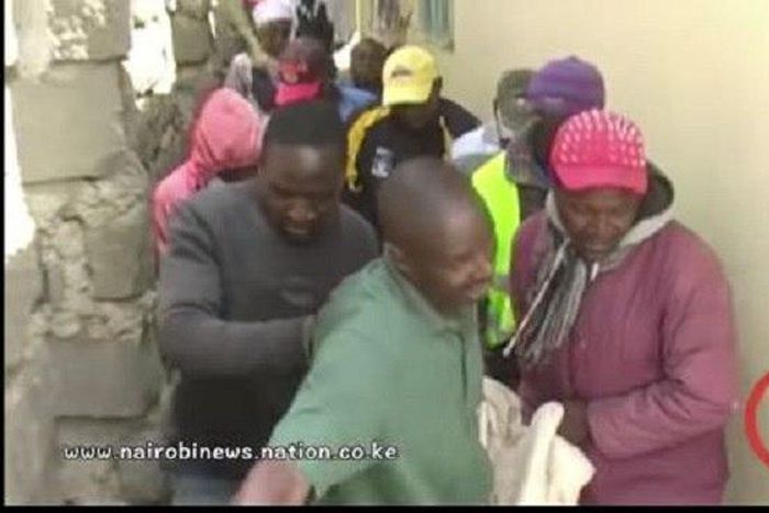 The cheating lovers being taken out of the hotel