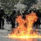 The Venezuelan National Guard stands guard as they clash with opposition activists clash in Caracas on April 13, 2017