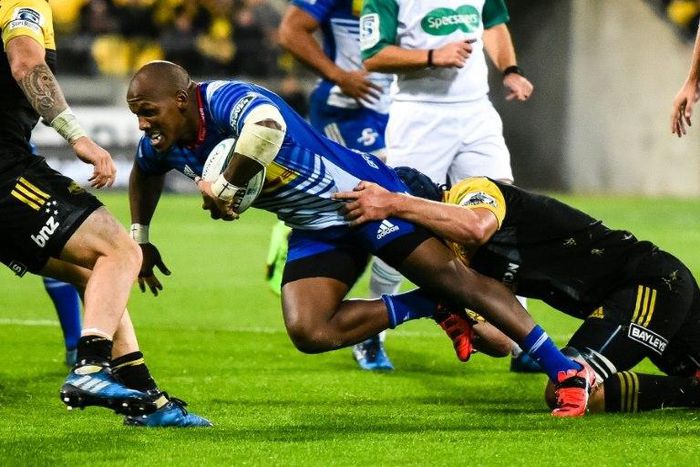 Stormers' Bongi Mbonambi is tackled during the Super Rugby match between New Zealand's Hurricanes and South Africa's Stormers, which ended in a 41-22 victory for the Kiwi side.