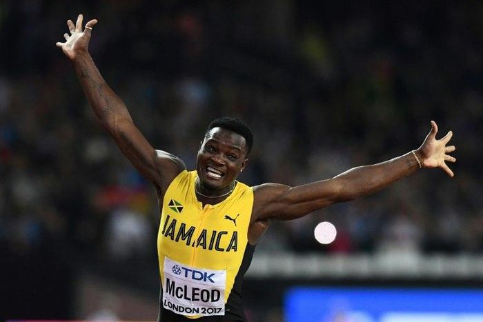 Jamaica's Omar Mcleod celebrates his victory in the final of the men's 110m hurdles at the 2017 IAAF World Championships in London on August 7, 2017