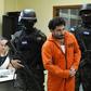 Police escort Plutarco Antonio Ruiz after he was found guilty of the 2014 murder of then Miss Honduras Maria Jose Alvarado, 19, and her sister Sofia Trinidad Alvarado, 23