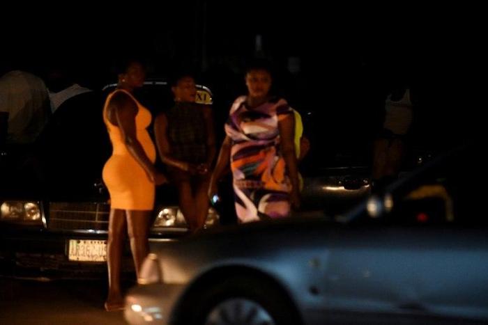 Prostitutes stand on the street in Benin City, Nigeria's capital for illegal migration. International Organization for Migration has recorded an explosion in the number of Nigerian women trafficked into Europe