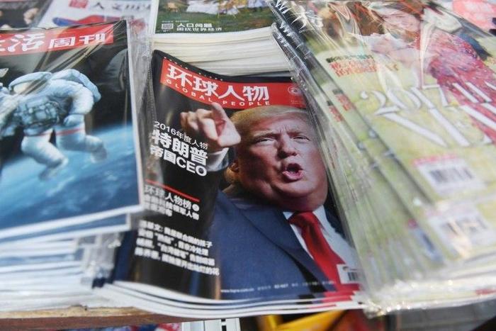 A Chinese magazine with a front page story naming US President-elect Donald Trump as their Person of the Year is seen at a news stand in Beijing