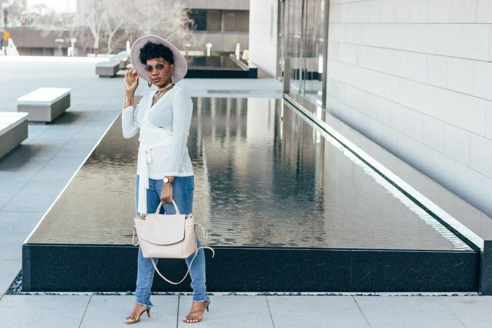 Advertising expert and blogger Seyi Famuyiwa pairs denim and top with kitten heels