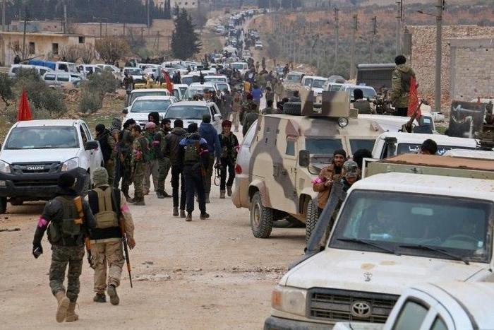 Turkey-backed-opposition fighters regroup as they advance on the western outskirts of the northern Syrian city of al-Bab in a bid to enter the city and retake control of it from the Islamic State (IS) group on February 9, 2017
