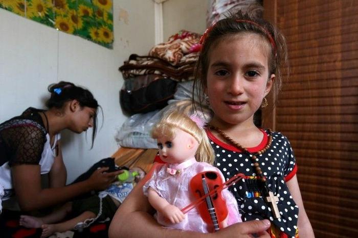 Christina, 6, is reunited with her family three years after her abduction by jihadists in Iraq