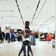 AY Makun and his daughter in a mall in Houston during their vacation
