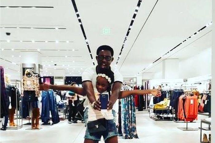 AY Makun and his daughter in a mall in Houston during their vacation