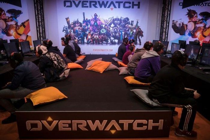 Visitors play the video game "Overwatch" at the 2016 Paris Games Week. Game developer Activision is creating an eSports league around the game