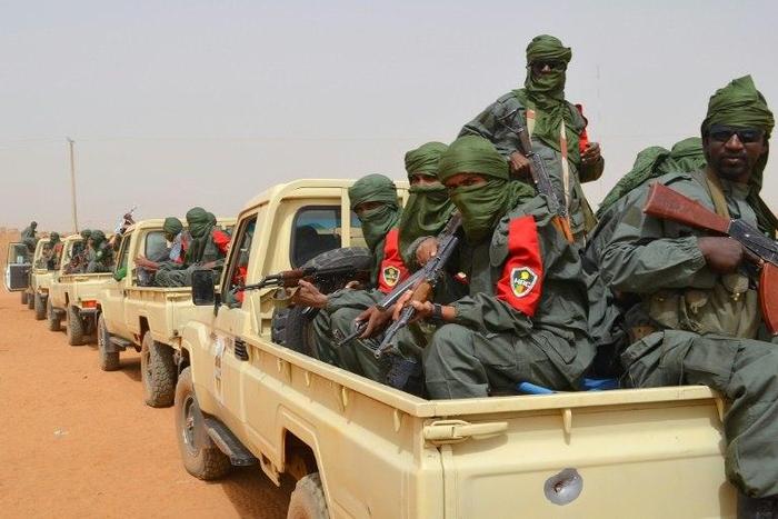 Malian army soldiers, pro-government militia members and former rebels, take part in their first joint patrol in Gao in northern Mali in February