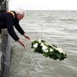 West-Flanders province governor Carl Decaluwe throws a wreath to the sea during a tribute ceremony for the 30th anniversary of the Herald of Free Enterprise ferry disaster