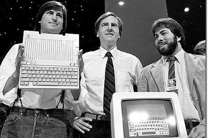 Apple Co-founders Steve Jobs (left) and Steve Wozniack (far right) at the Apple IIc launch on April 24, 1984.
